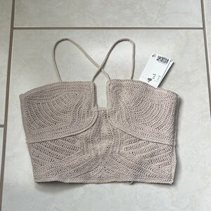 NWT Women’s knit top, with adjustable straps and crus cross tie back design